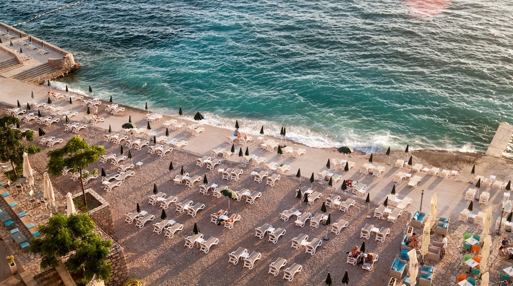 top view of the illuminated by the setting rays of the sun the beach on the Adriatic sea in the town of Dobra Voda, Montenegro
