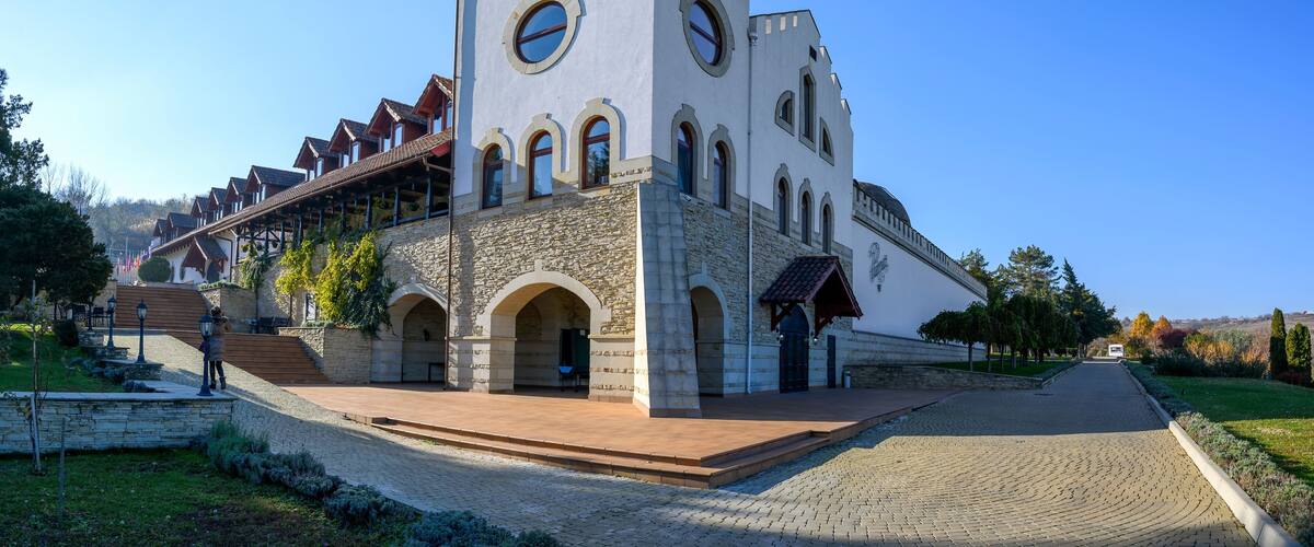 A historic church with a bell tower, arched windows, and a stone facade.