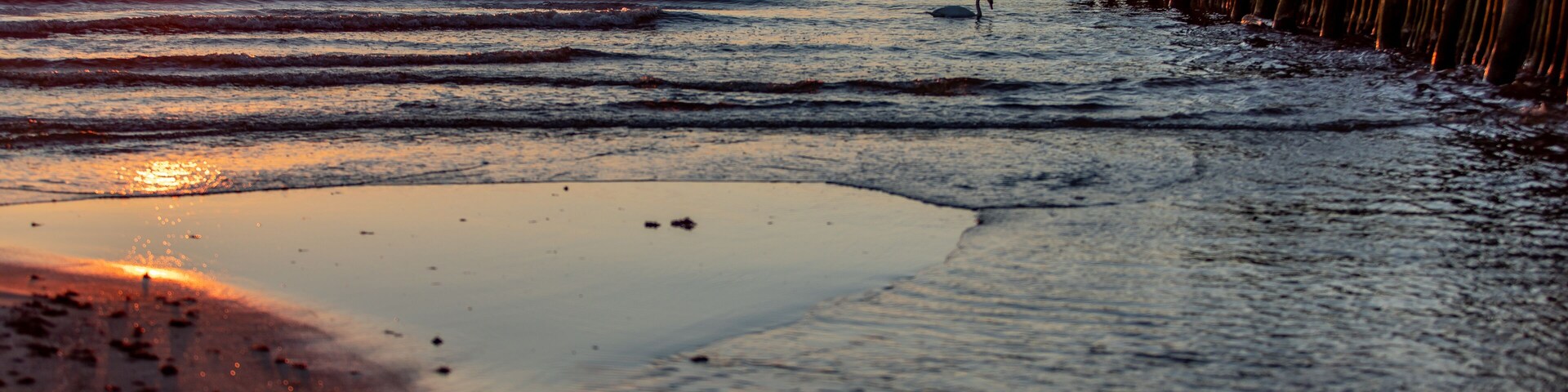 Sunset and old bridge ruins in Sventoji Lithuania