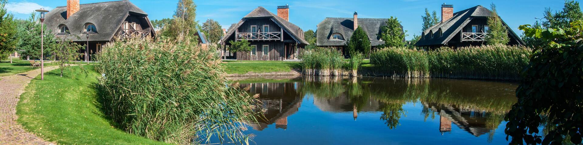 Old wooden houses with reed roofs
