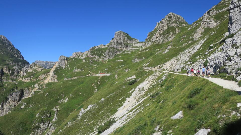 A mountainous landscape with a hiking trail.