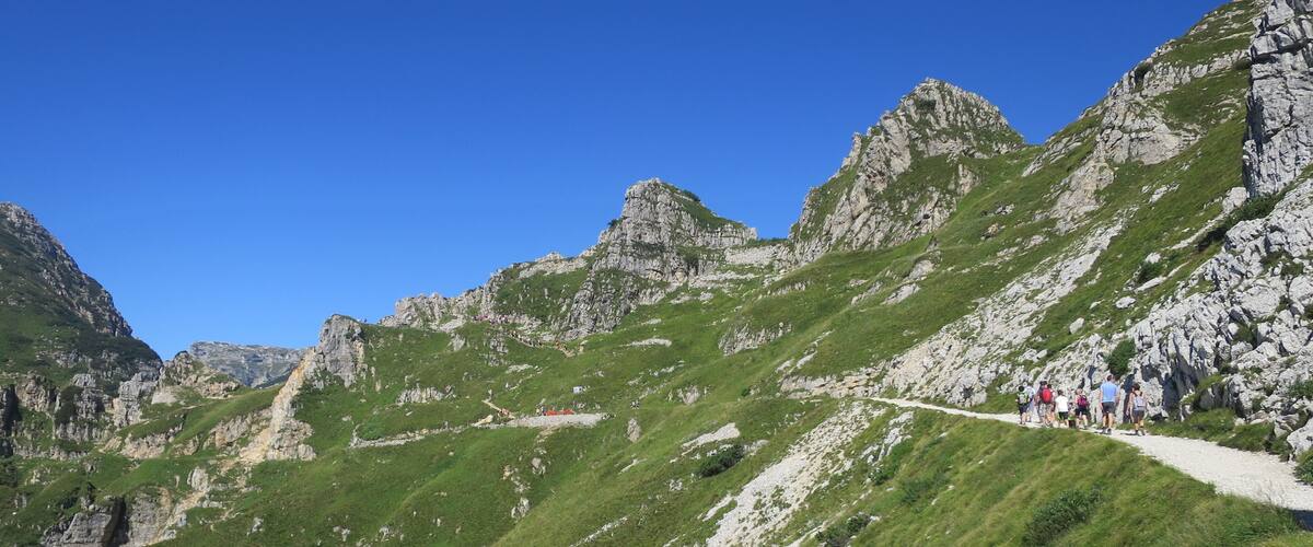 A mountainous landscape with a hiking trail.