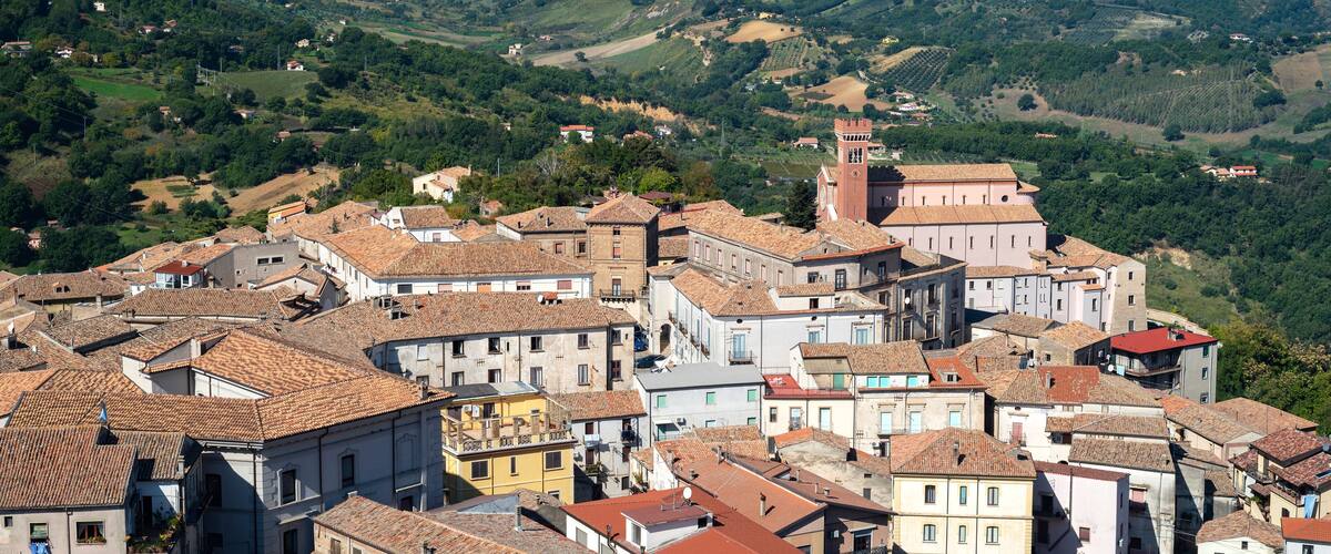 A mountainous landscape with a town nestled in the valley.