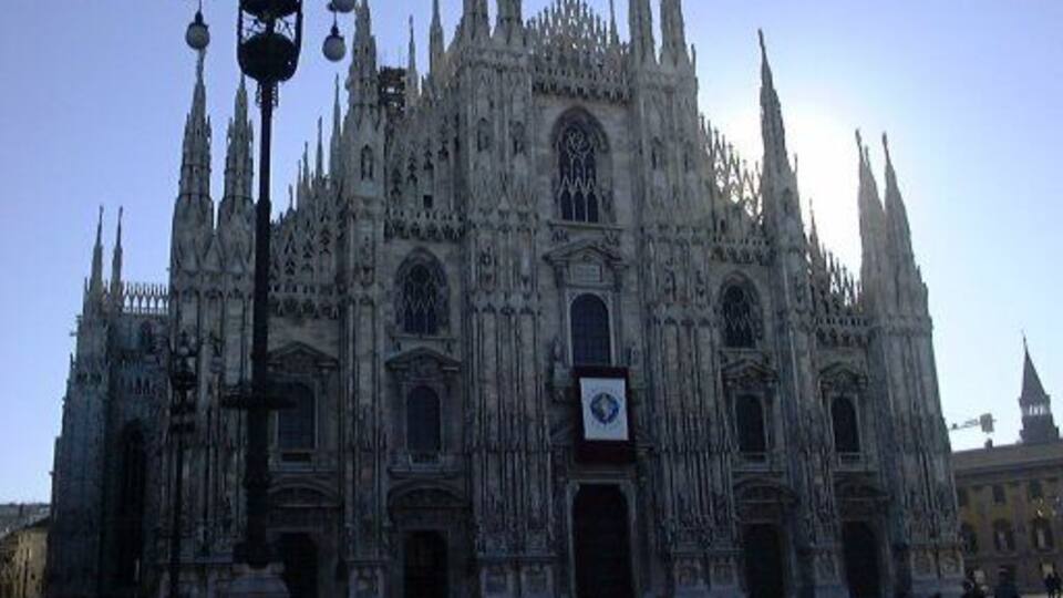 A Gothic cathedral with intricate spires and a large central doorway.