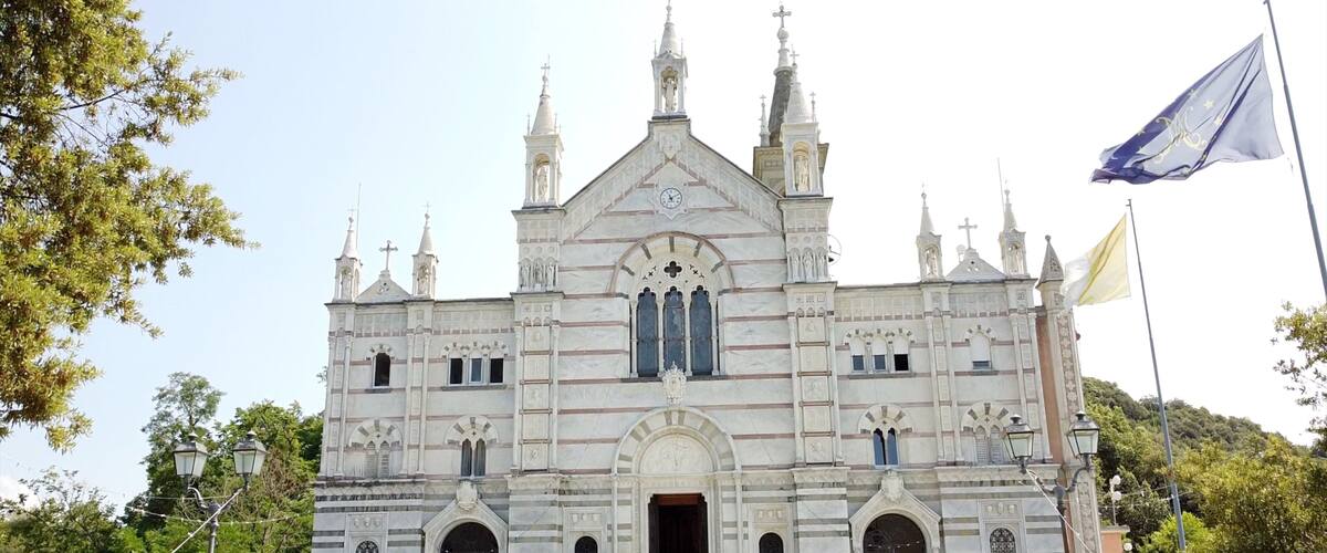 A large, ornate church with multiple spires and a prominent clock tower.