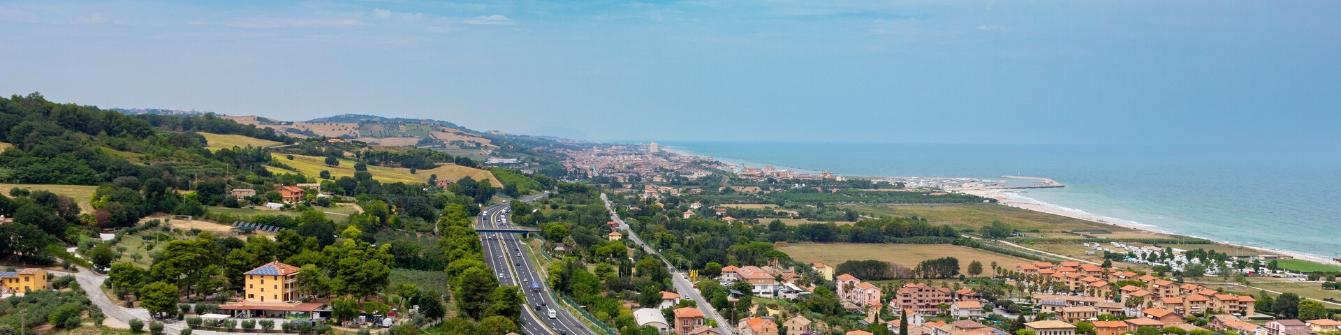 Vista from Torre di Palme to the villages of Marina Palmense and Santa Maria a Mare, over the E55 highway in Marche region in Italy.
