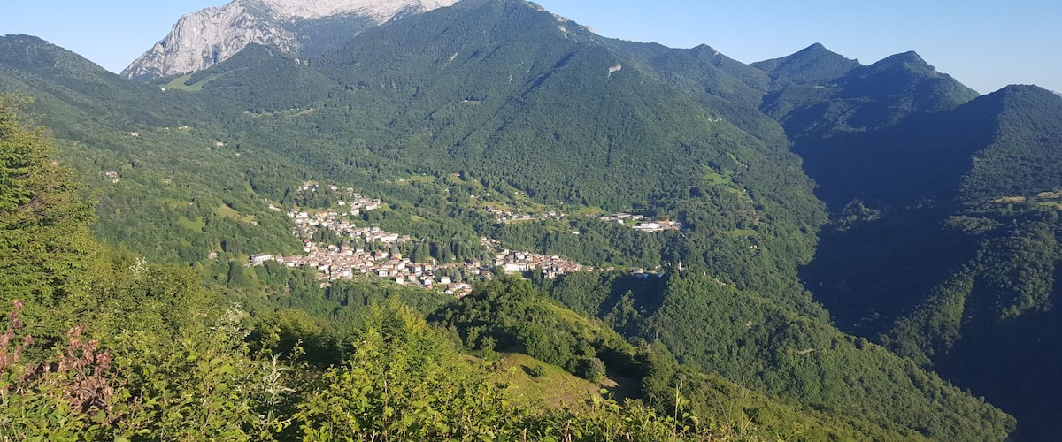 A mountainous landscape with a small town nestled in the valley.