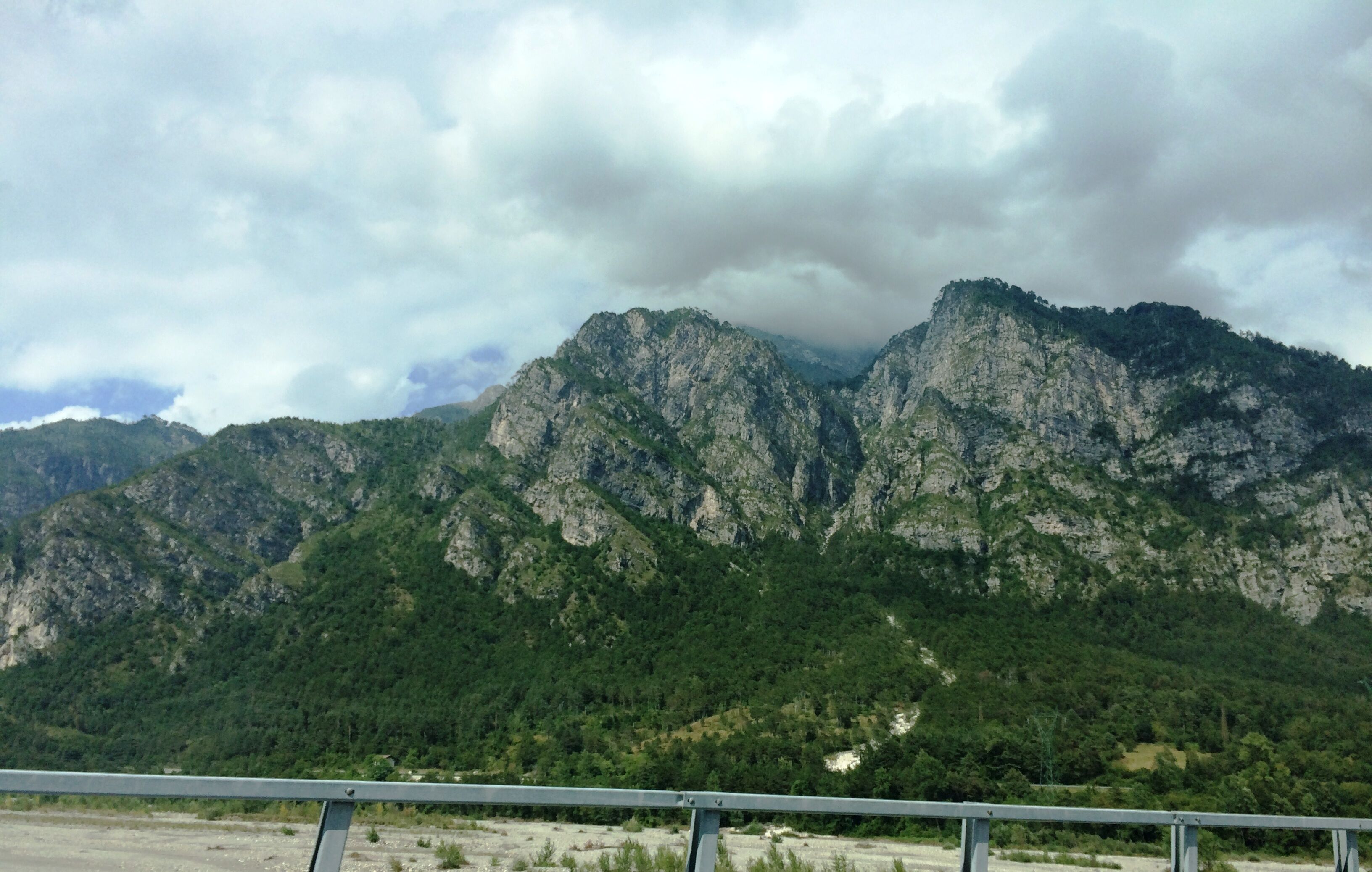 A mountain range with a cloudy sky.
