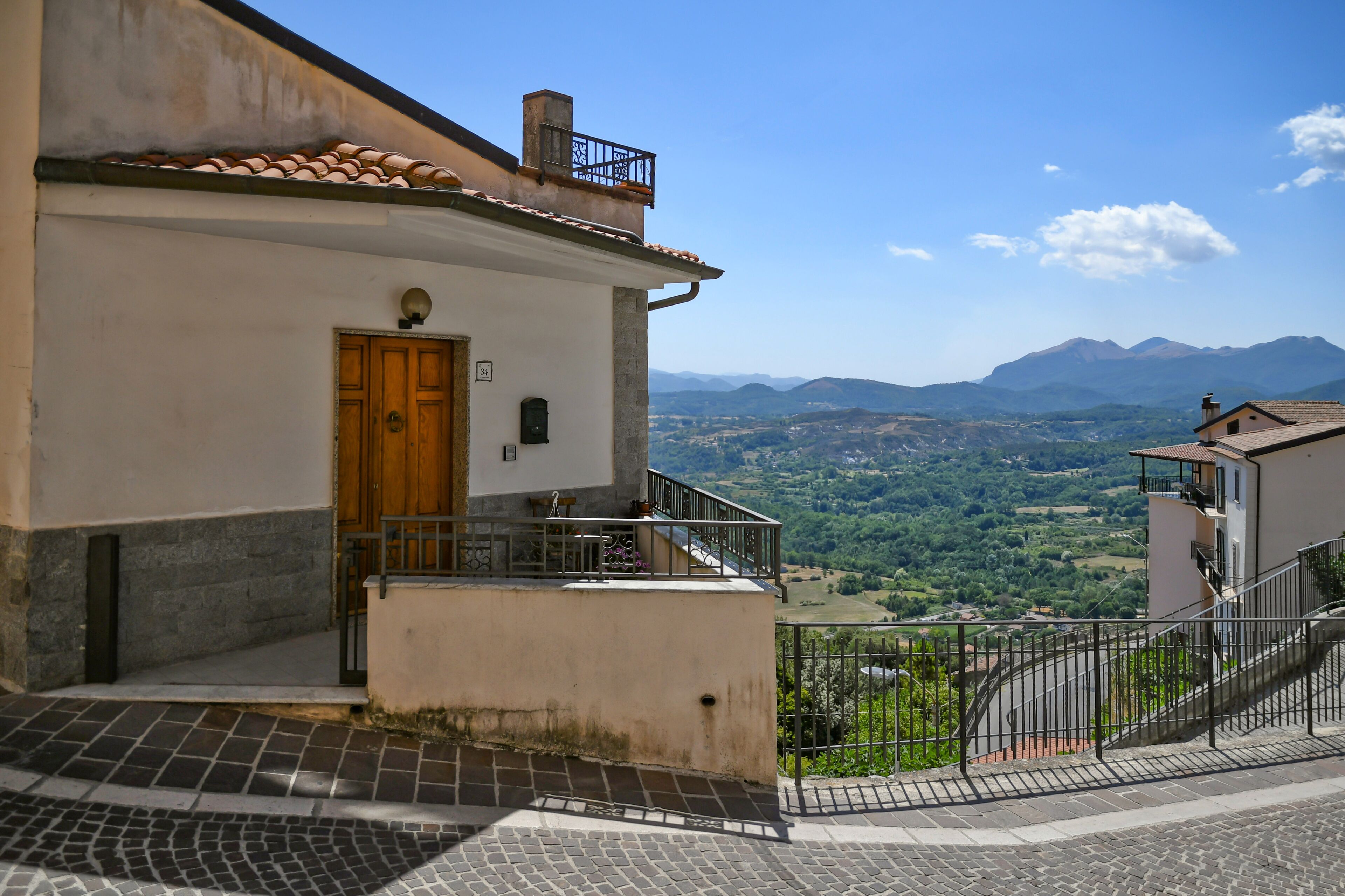 A small street between the old houses of Castelluccio Superiore, a small town in the province of Potenza in Basilicata, Italy.