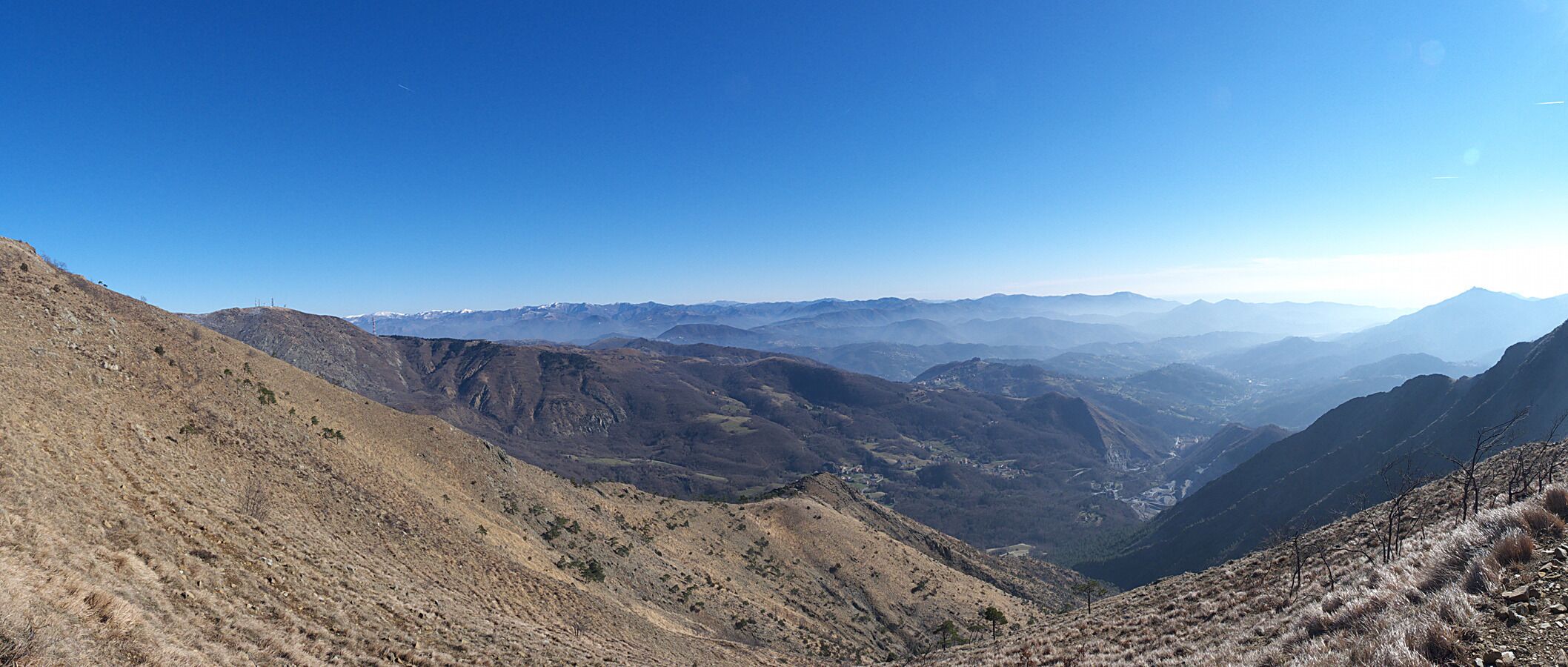 A mountainous landscape with rugged terrain and a valley.