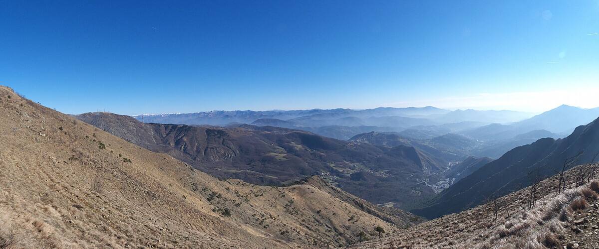 A mountainous landscape with rugged terrain and a valley.