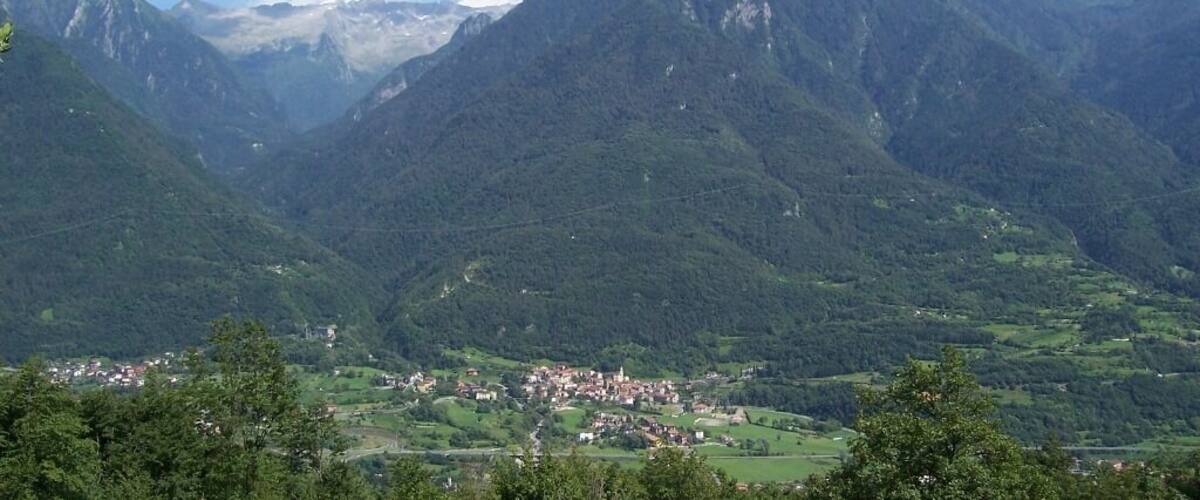 A mountainous landscape with a small town nestled in a valley.