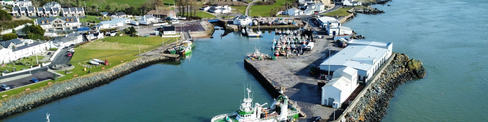 Bird's eye view of Greencastle Harbor with moored boats. Donegal, Ireland.