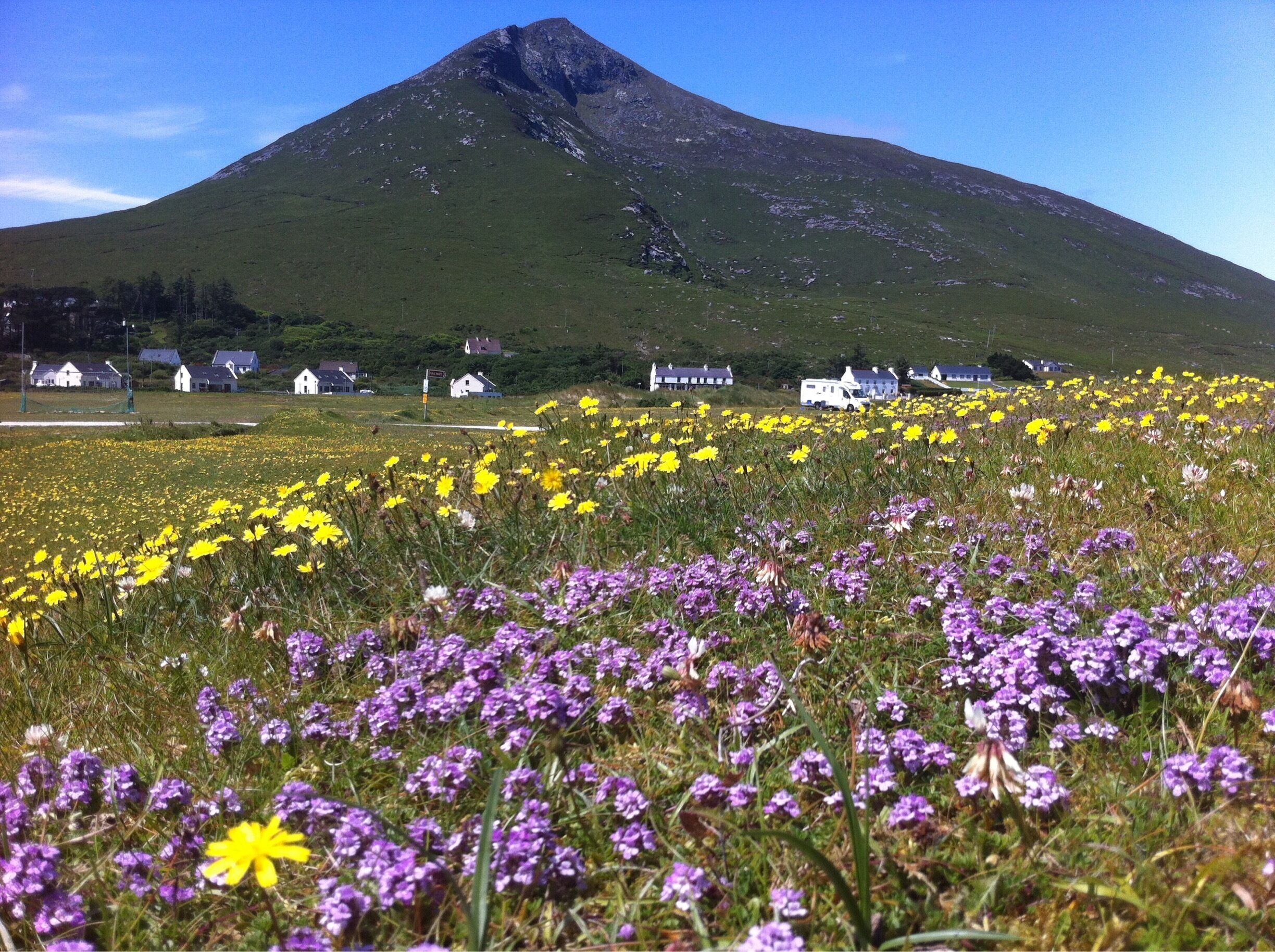 A mountain with houses in the valley.