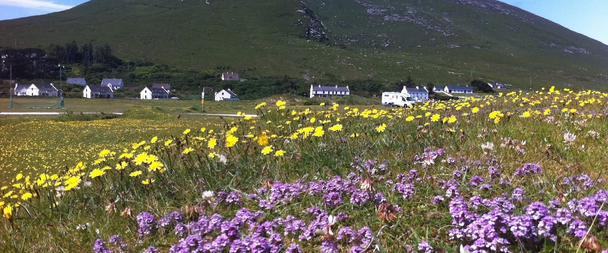 A mountain with houses in the valley.