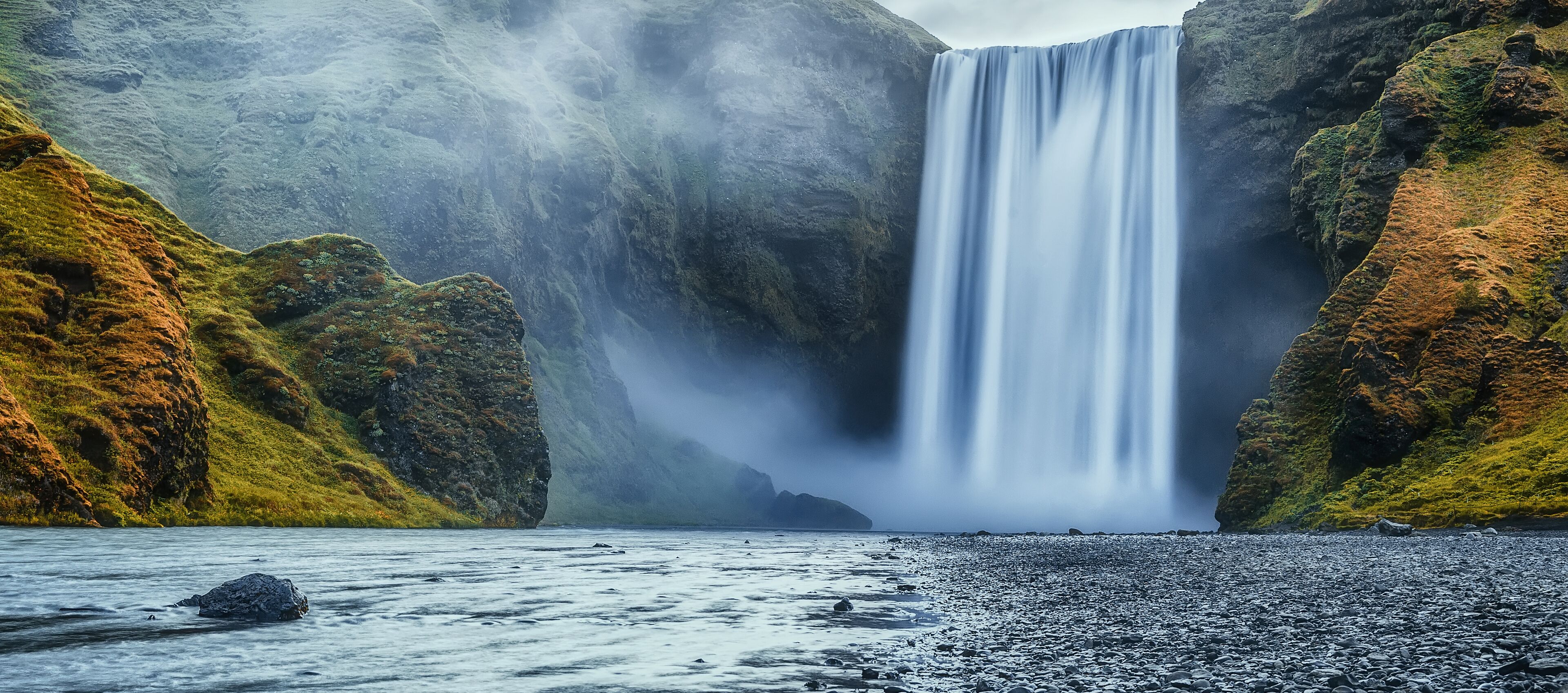 Impressive scenery of the majestic Skogafoss Waterfall of Iceland during sunrise. Amazing landscape with dramatic picturesque sky. Iceland the most beautiful and best travel place. Beauty of World
