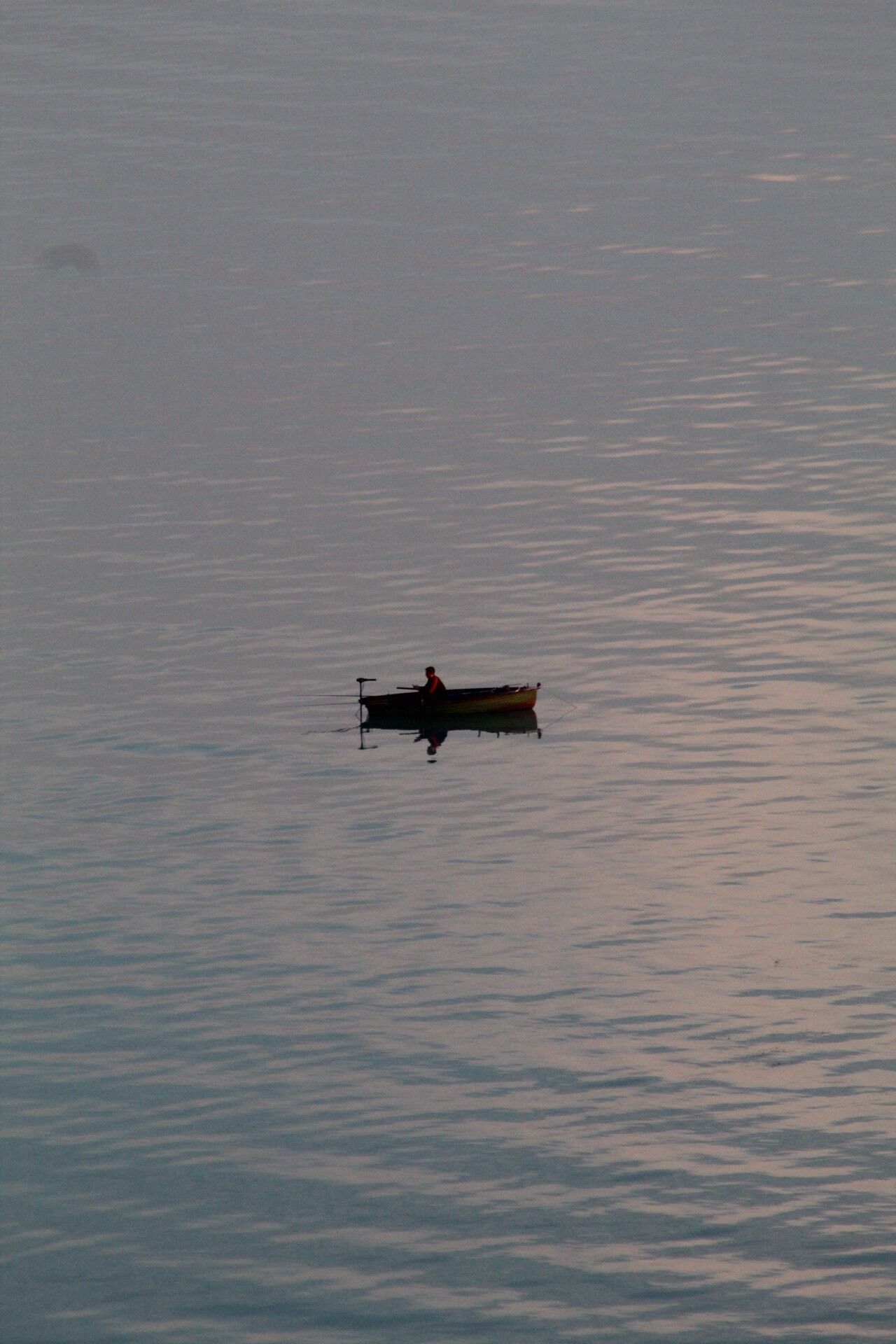 A small boat on calm water.