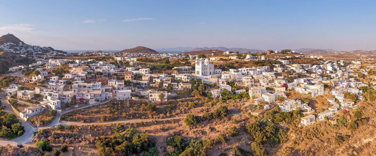 Panoramic aerial view of Tripiti village at sunset, Milos island, Greece