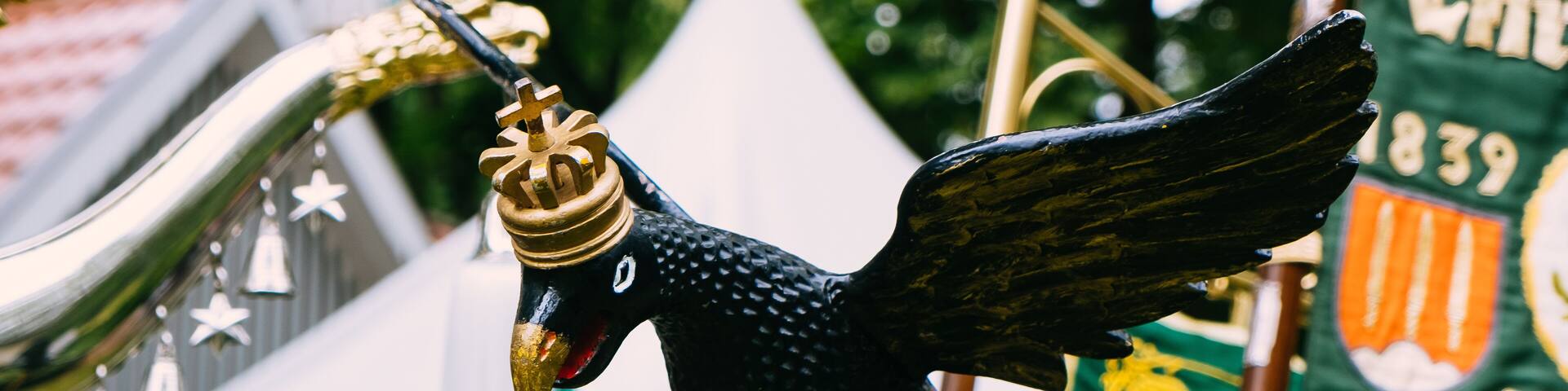 Banner and wooden eagle and other insignia of the mercenaries at the "Schützenfest" in Sassenberg, Germany