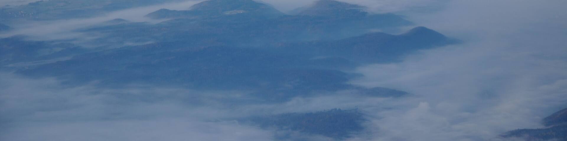Germany, the steam of Leibstadt nuclear power plant pushing through the fog. Picture taken overhead Gailingen during an approach to Zurich.