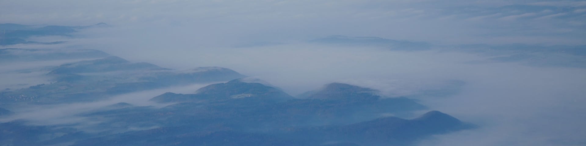 Germany, the steam of Leibstadt nuclear power plant pushing through the fog. Picture taken overhead Gailingen during an approach to Zurich.