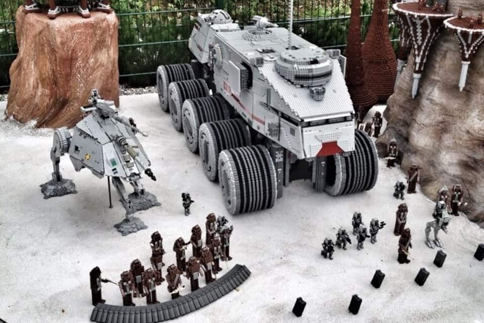 A Star Wars themed LEGO diorama with a large vehicle, figures, and structures.