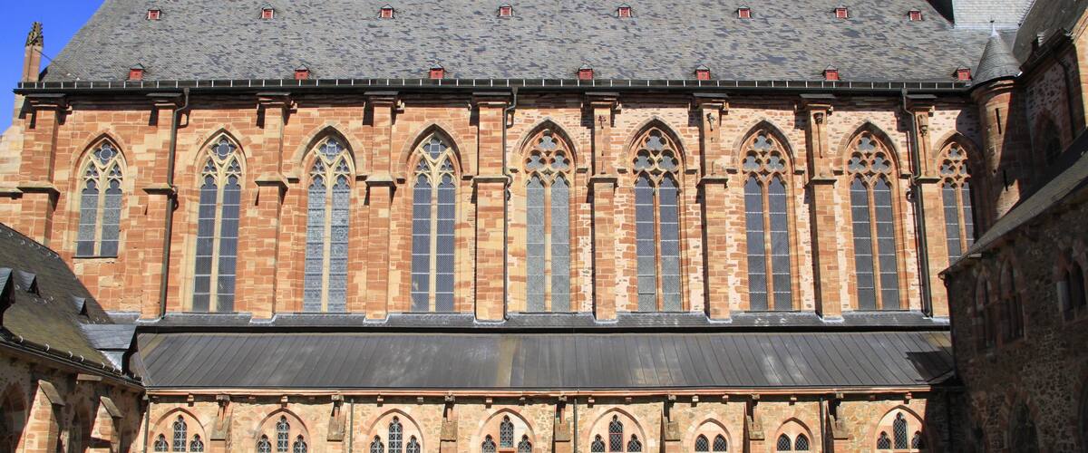 A historic church with arched windows and a stone facade.