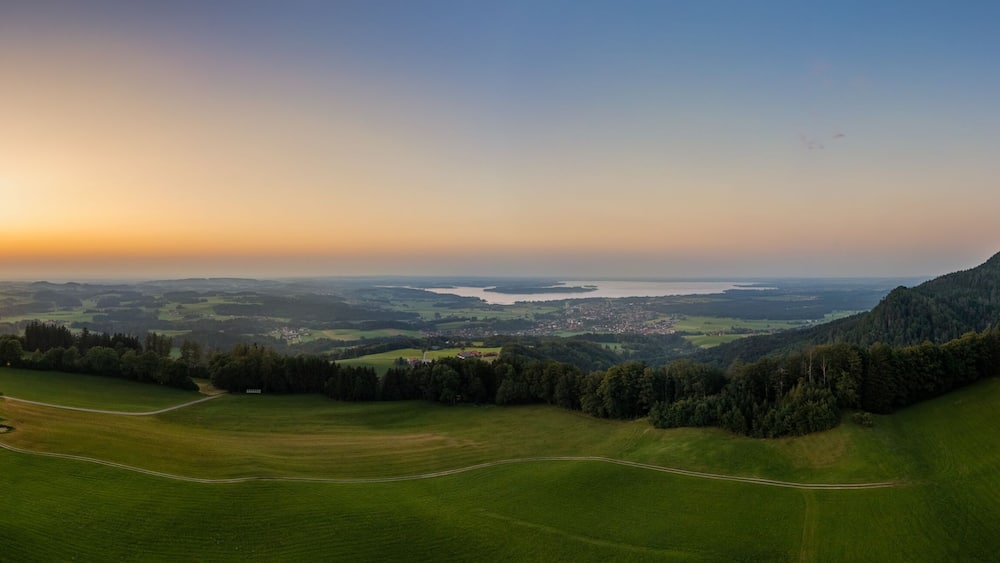 A breathtaking sunset over the popular bavarian Chiemsee next to the alps mountains. Wonderful holiday destination at summertime.