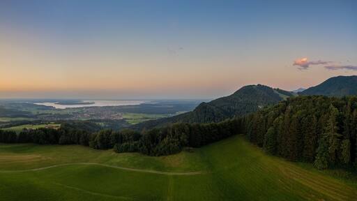 A breathtaking sunset over the popular bavarian Chiemsee next to the alps mountains. Wonderful holiday destination at summertime.