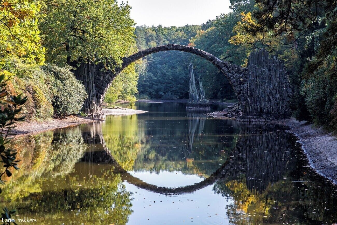 Rakotzbrucke, also called the Devil's Bridge, looks like something that belongs in a fairytale. It is located in Saxony, Germany. Getting here can be a bit of a challenge, since it is not really located near any major city, but we visited this bridge on a day trip from Berlin.

Learn how to visit Rakotzbrucke: http://www.earthtrekkers.com/rakotzbrucke-fairytale-bridge-saxony-germany/