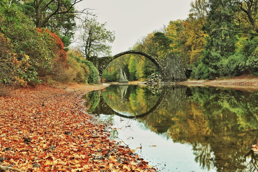 Travelling has taken me to many places but this trip I wanted to find the "Devils Bridge". A couple of hours from Berlin near the Polish border you can find Kromlau Park. Here is Ratozbrucke. An engineering feat from 1860 where the bridge makes a complete circle in reflection. Many myths surrounding this and other bridges like it around the world. Enjoy if you get here. #nature #bridges #traveltheworld #history #parks