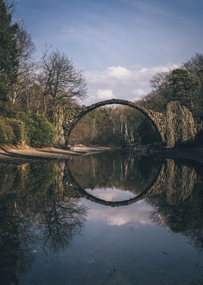 A delicately arched devil’s bridge known as the Rakotzbrücke, which was specifically built to create a circle when it is reflected in the waters beneath it.