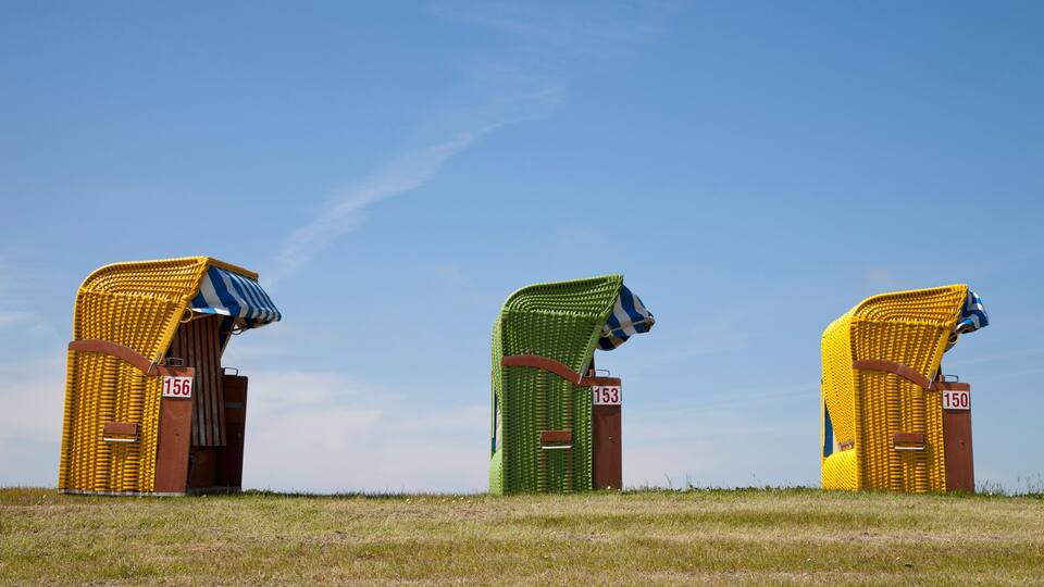 Three straw bale structures with numbers 156, 153, and 150.