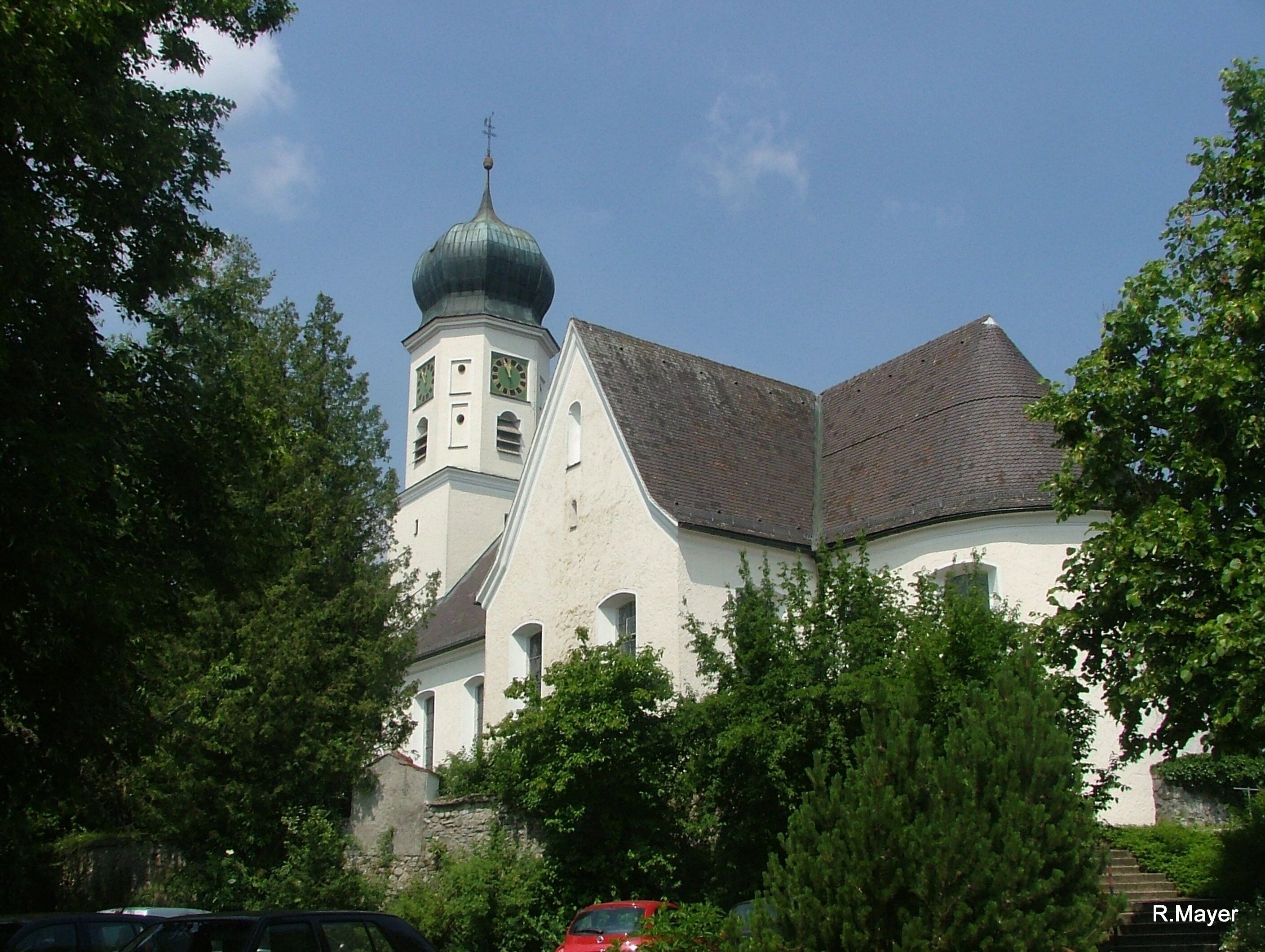 A church with a clock tower and a dome.