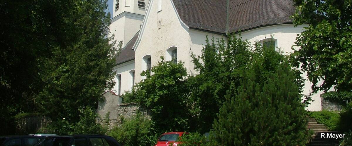A church with a clock tower and a dome.