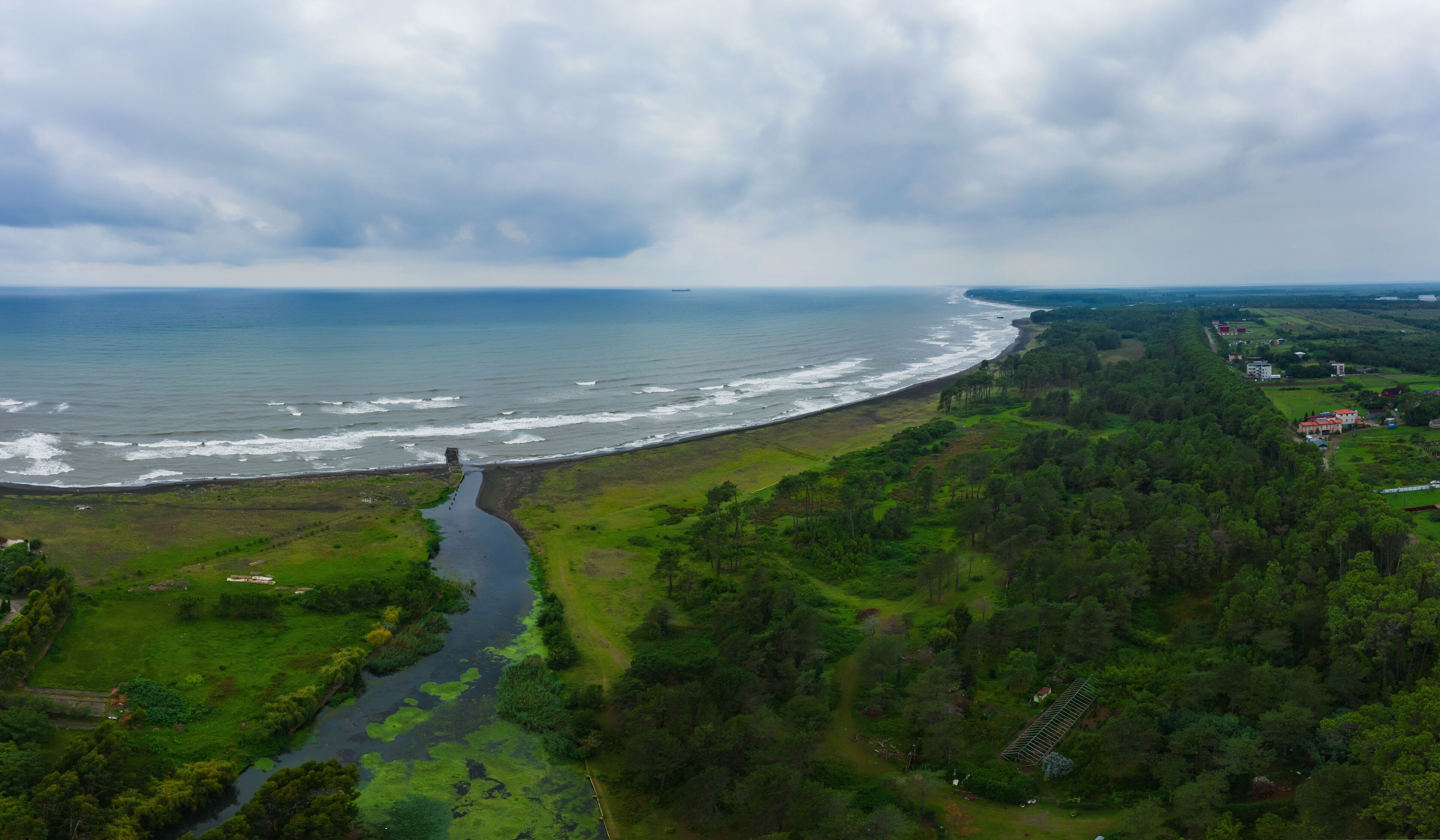 healing black sand beach in georgia. Magnetic sand on the beach in Magnetiti Batumi. High waves in the black Georgian sea in the village of Ureki