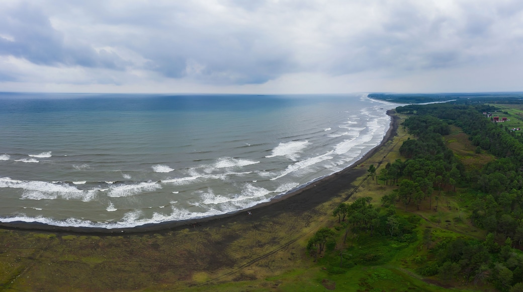healing black sand beach in georgia. Magnetic sand on the beach in Magnetiti Batumi. High waves in the black Georgian sea in the village of Ureki