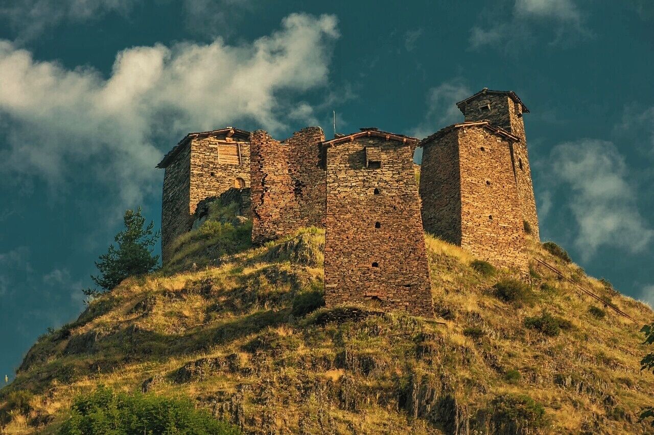 July 2010 
Keselo Fortress, Kvemo Omalo, Tusheti 

The top towers of Keselo,  a medieval fortress consisting of 13 towers built in 14-15th century, altitude is ca. 2.000 metres. The fortress originally served as protection against Mongol invaders and later against Dagestani invaders. It was mostly used only in summer months when the raids were usual. In winter people lived in the village below the fortress. It has lost its purpose in 19th century after the Russians allied with local Tushs. It was abandoned and destroyed during World War II. In 2003 the reconstruction started and sponsored by a Dutch family. Many of the towers were built back from ruins, accomodating a museum of local tradition with many old photos from the region. Keselo is few tens of metres over the village Kvemo (=Upper) Omalo, which is a usual starting point for trek west to Shatili in Khevsureti region or day hikes to Shenako or Diklo villages to the east. 