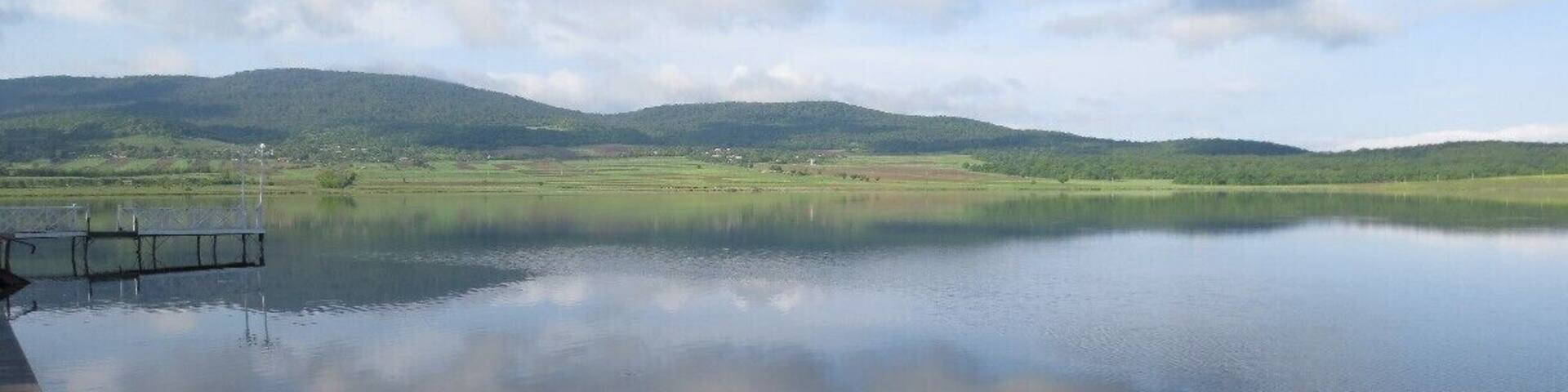 #Bazaleti View from a lake in the country of Georgia. This is the calm surface of a lake called Bazaleti.