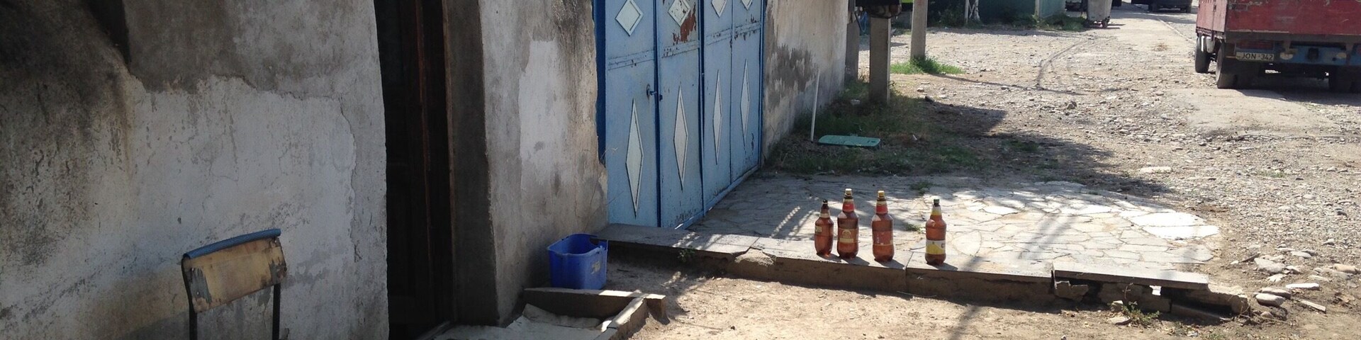 Street scene from the rural Georgian town of Bolnisi, Georgia. The building on the left is a barber shop.