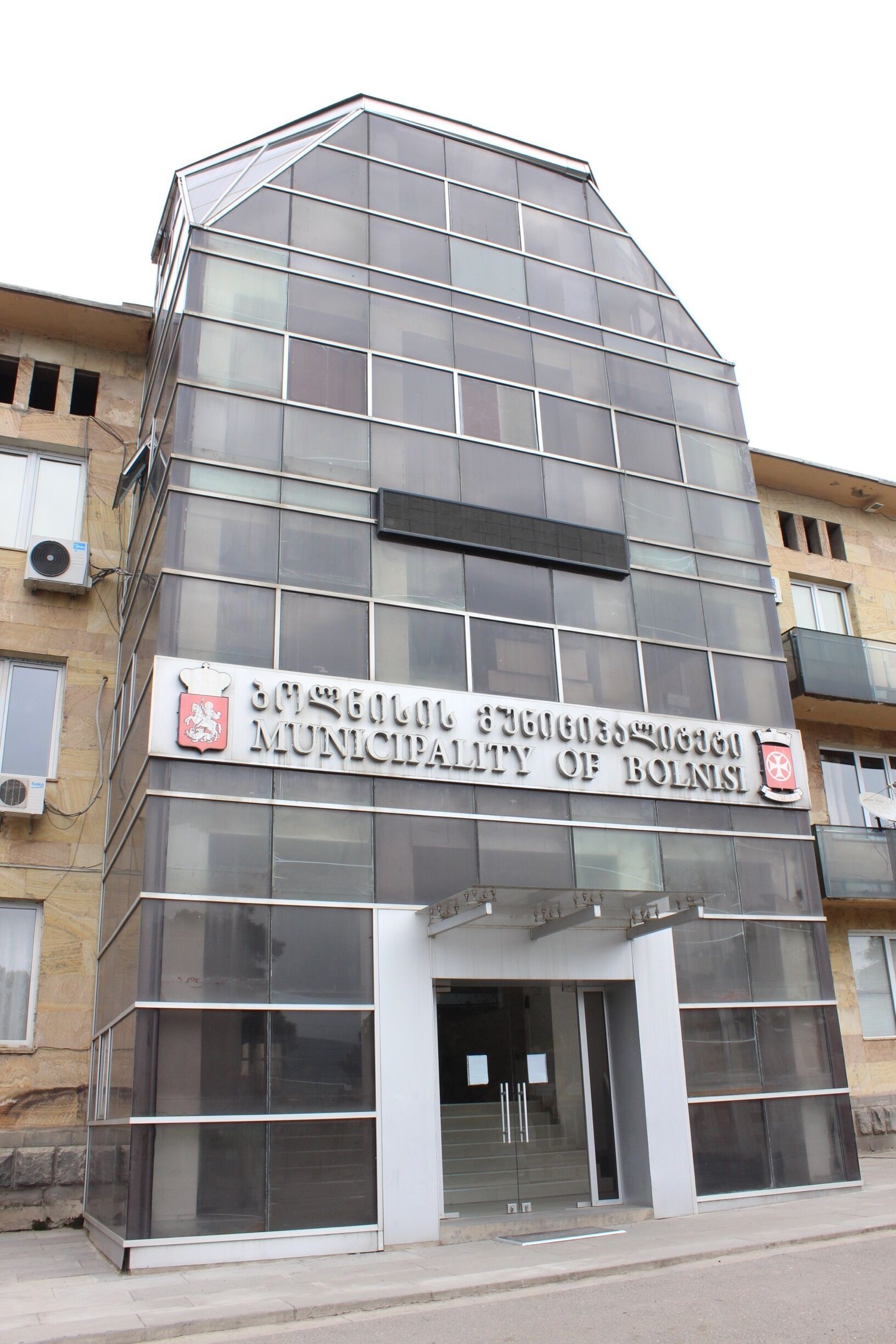 Municipal building in the rural Georgian town of Bolnisi.

Located in the Kvemo Kartli region of Georgia, Bolnisi was originally a German settlement. 

The Germans were removed during World War II, and now Bolnisi is ethnically Georgian. 