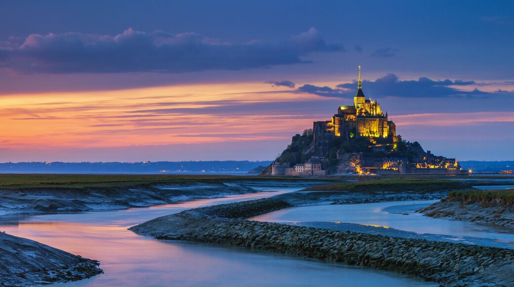 Panoramic view of famous Le Mont Saint-Michel tidal island at sunset, Normandy, northern France