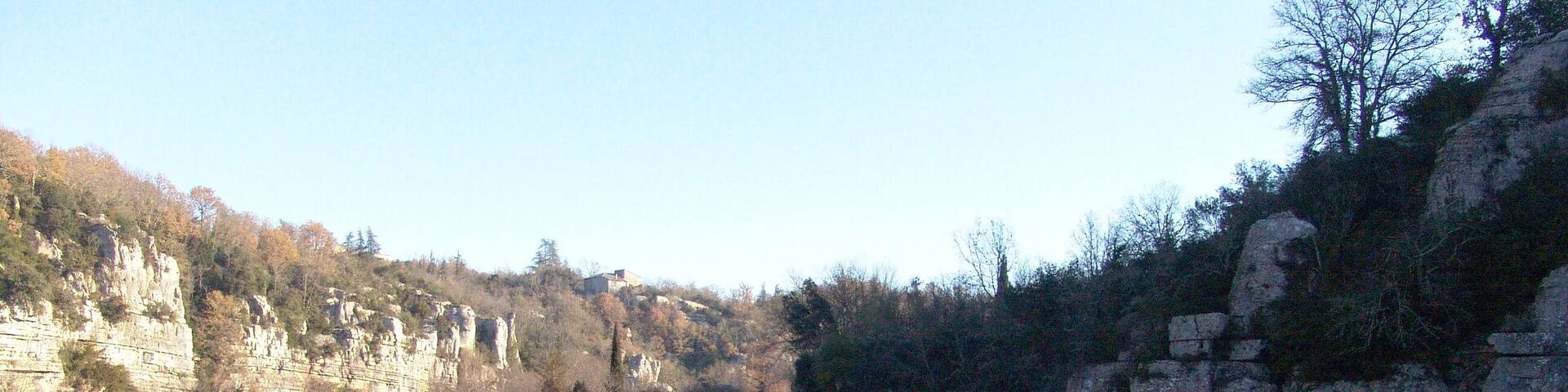 The river La Baume and stone gateway of Labeaume.