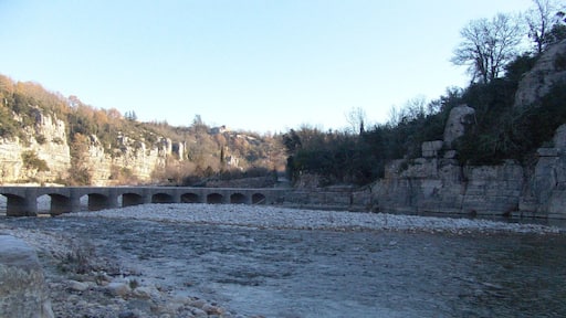 The river La Baume and stone gateway of Labeaume.