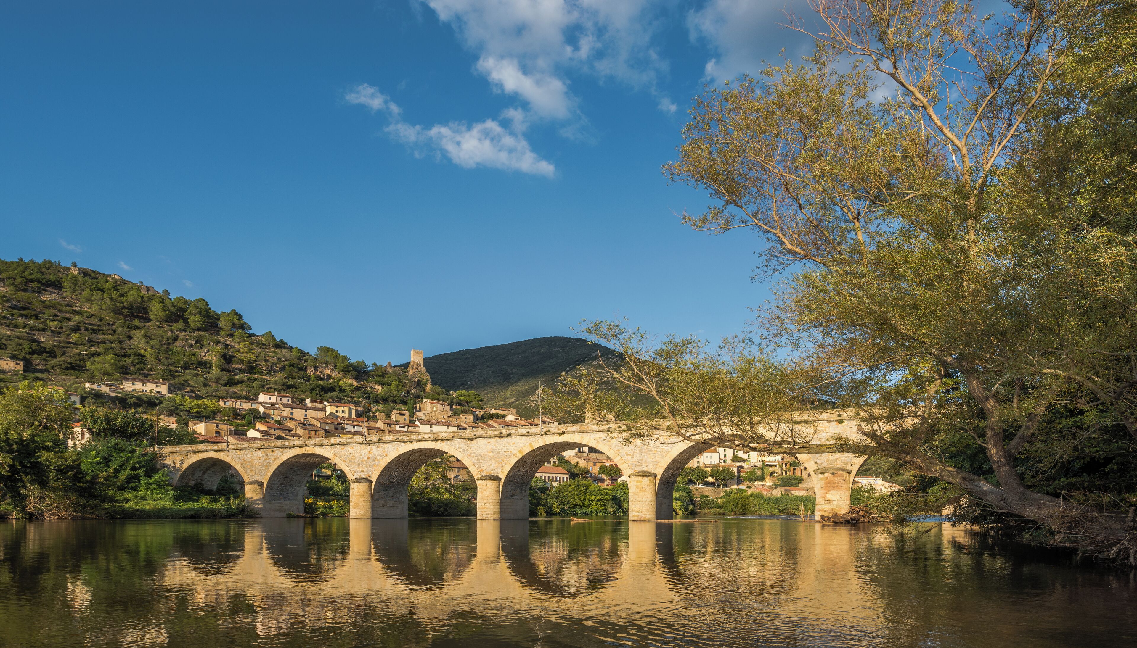 The Bridge above the Orb River, arch bridge of 7 archs dated from 1870. Seen from the Southwest. Roquebrun, Hérault, France. Haut-Languedoc Regional Natural Park.