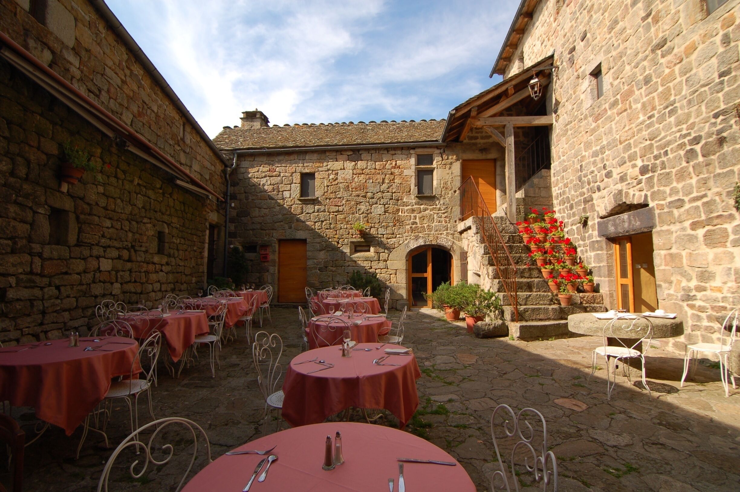 The courtyard restaurant at the Auberge La Régordane in La Garde Guérin France. One of the best al fresco #restaurant experiences we've ever had. #france #ardeche #cevennes #europe #food http://www.acooknotmad.com/2011/09/on-the-road-to-ardeche.html #roadtrip