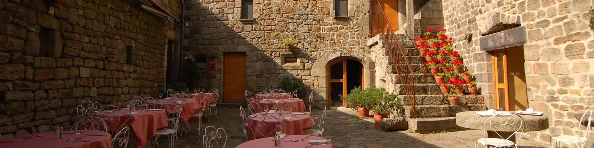 The courtyard restaurant at the Auberge La Régordane in La Garde Guérin France. One of the best al fresco #restaurant experiences we've ever had. #france #ardeche #cevennes #europe #food http://www.acooknotmad.com/2011/09/on-the-road-to-ardeche.html #roadtrip