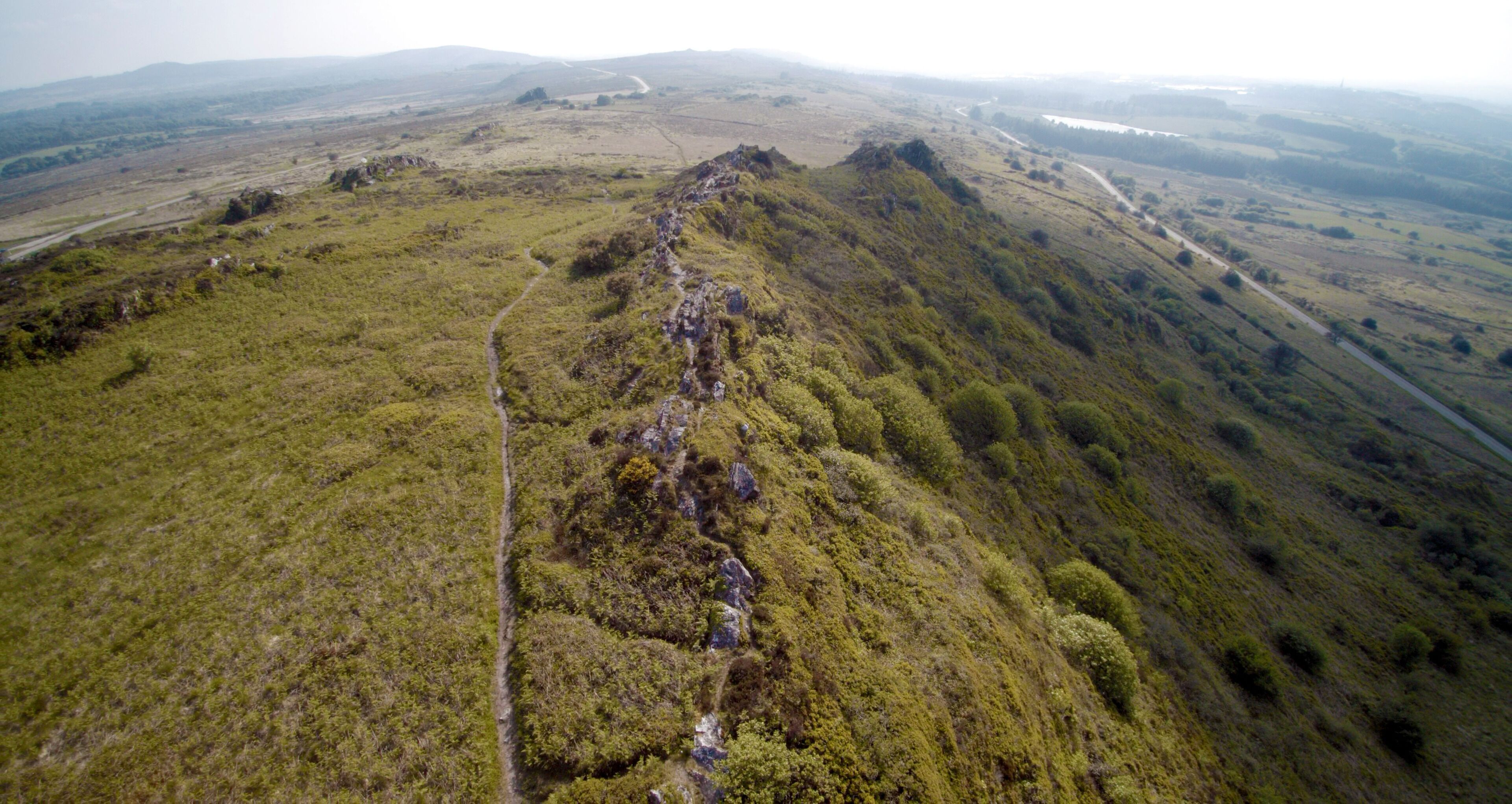 A mountainous landscape with a winding path.
