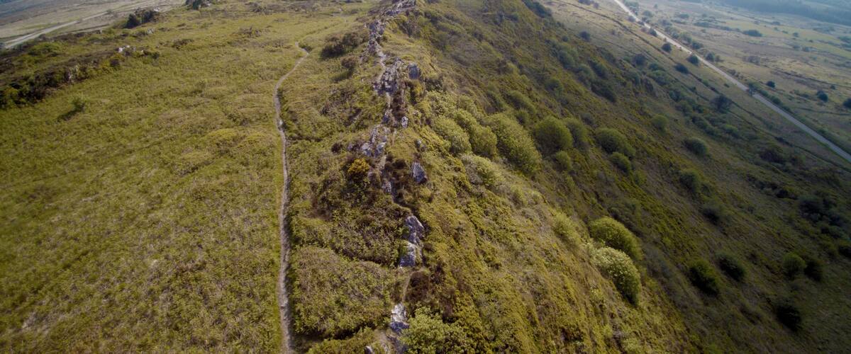 A mountainous landscape with a winding path.