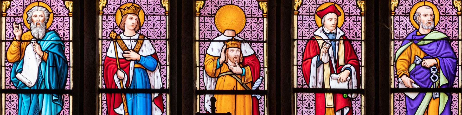 Ploumilliau (Plouilio), France. Stained glass window in St Miliau Church depicting saints John, Melor, Milliau, Ivo and Peter